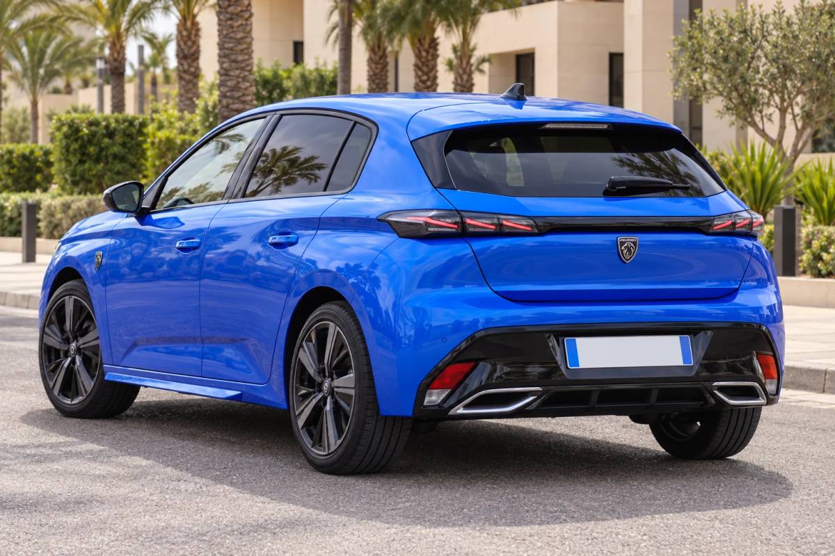 Peugeot 308 rental car, rear three-quarter view