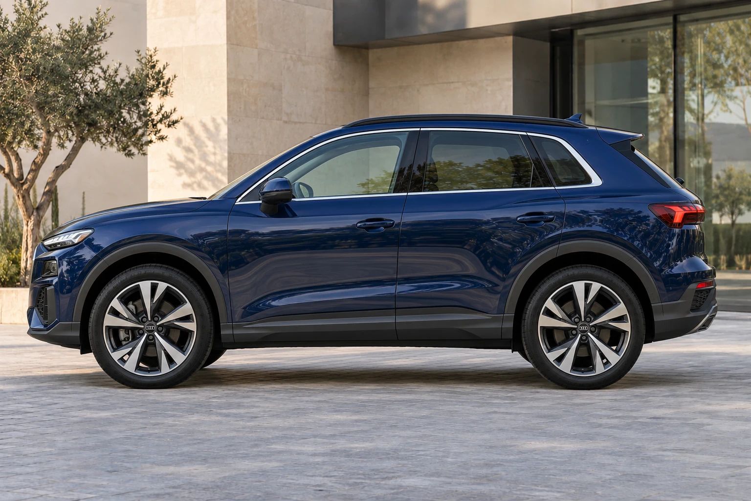 Blue 2026 Audi Q3 rental SUV, side profile